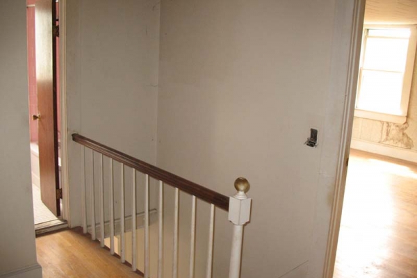 Entrance Stair w/ Master Bed to right and Demo’d bath to left